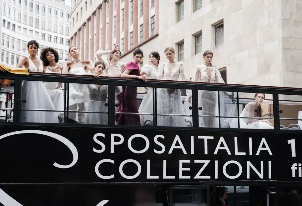 Sì Sposaitalia Collezioni Milano Bridal Week wedding dress models on the bus